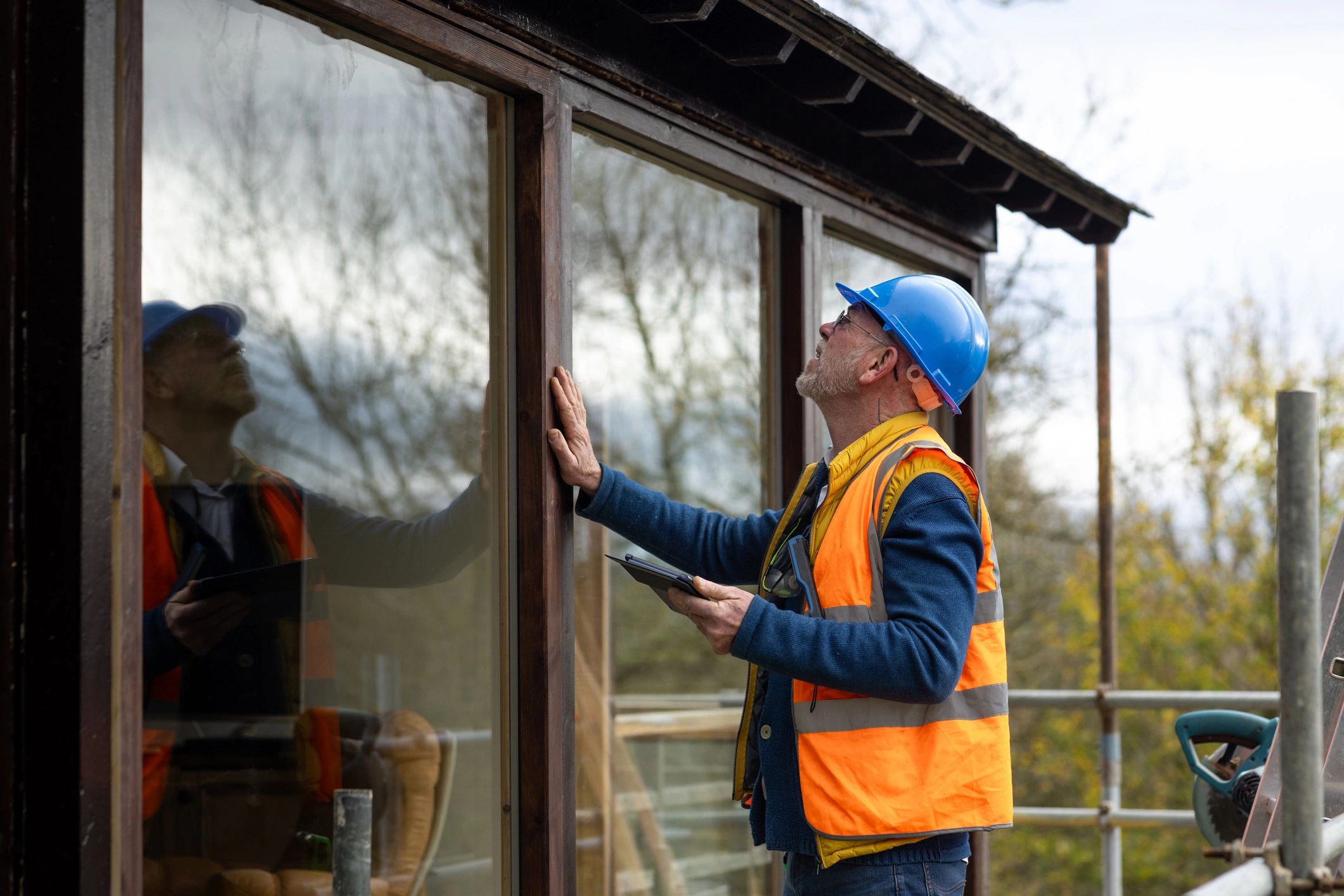 Technician performing air conditioner maintenance